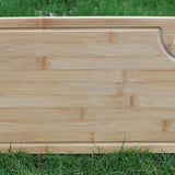 Reverse side of a bamboo chopping board with juice groove