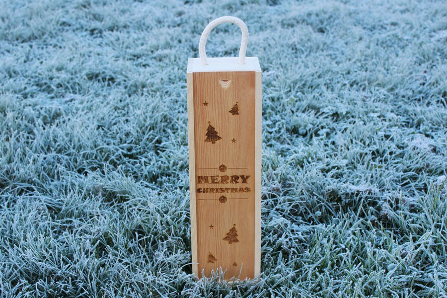 Personalised Christmas wooden wine gift box engraved with stars, trees and baubles