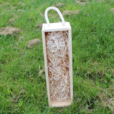 Single wooden wine gift box with rope handle, open and filled with wood wool padding