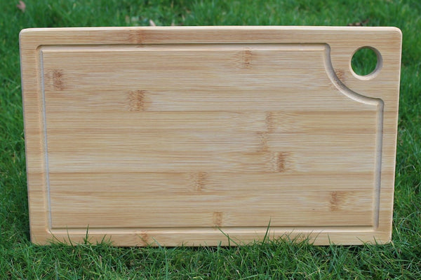 Reverse side of a bamboo chopping board with juice groove